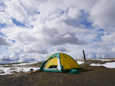 P1130480 ©05 Tim Satterfield Evening camp set up along a snowfield waiting for the storm.